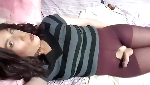 Horny shemale enjoys a solo masturbation video with her