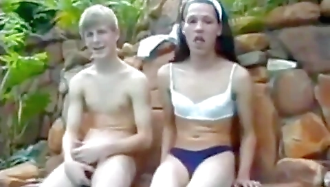 An old brunette with a tattooed ass is out for a hike