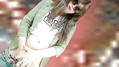 Asian woman in a bikini is fucking in front of a cam